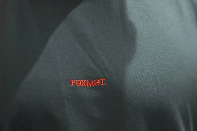 Wild Green tee with РӘХМӘТ. embroidered in red thread